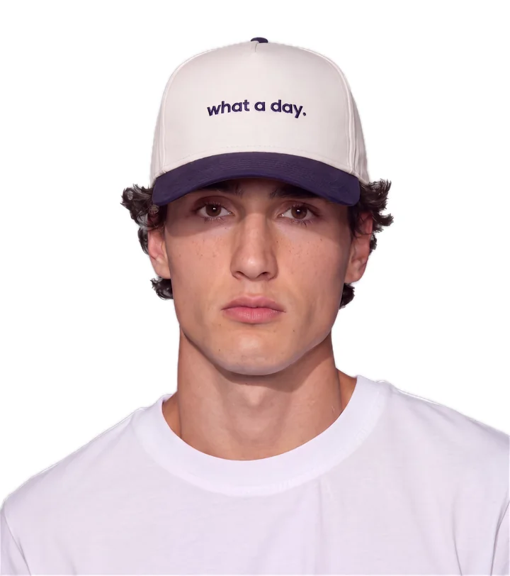 wearing the cap, facing forward: what a day. across the front